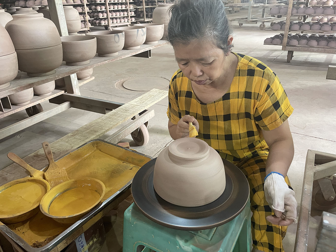 Craftsmen use manual techniques to print terracotta products