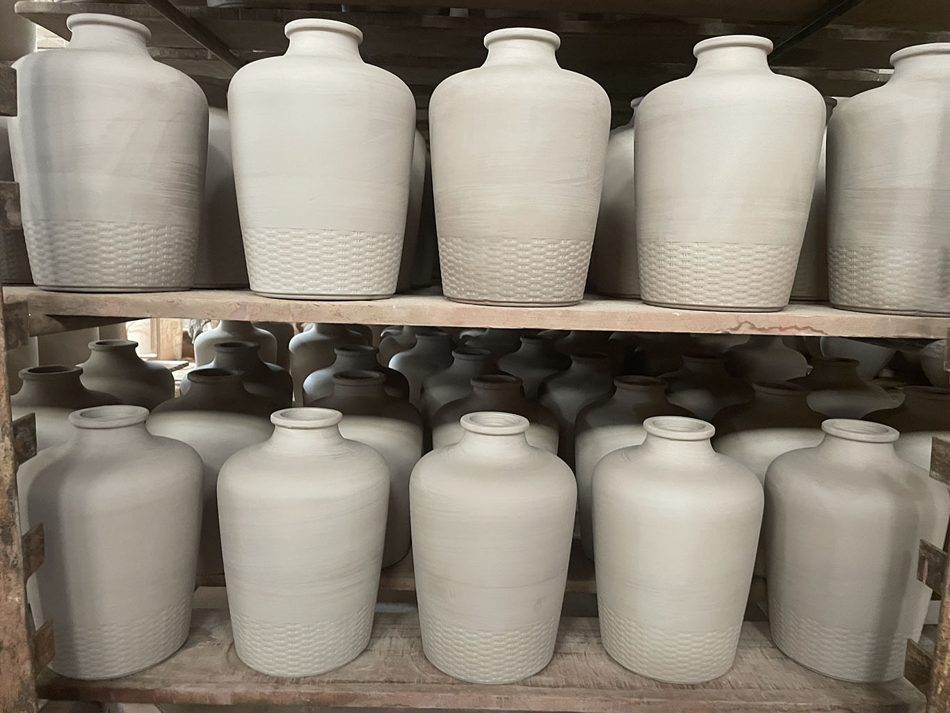 terracotta bottles waiting for natural drying to complete in the drying workshop