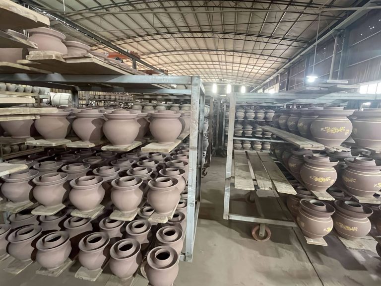 The kimchi crocks waiting to be glazed on the shelf