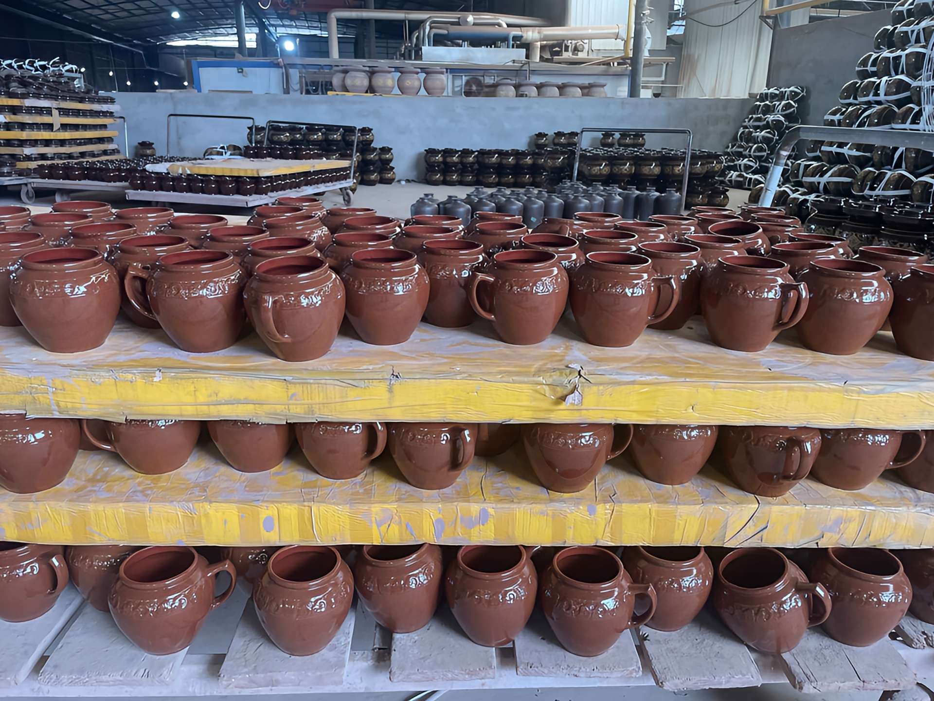terracotta kitchen storage jars on shelves