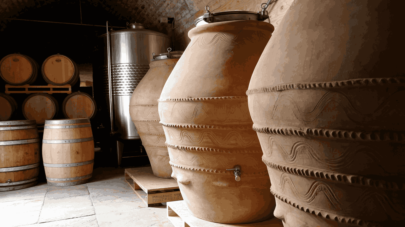 Combination of stainless steel tanks, terracotta amphorae and oak barrels used in professional winery fermentation